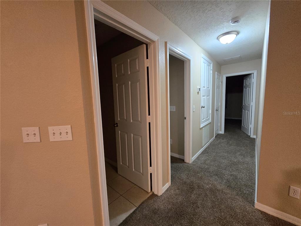8 Windrose Drive Orlando, FL 32824 - Photo 19 of 23 a view of a hallway with closet area
