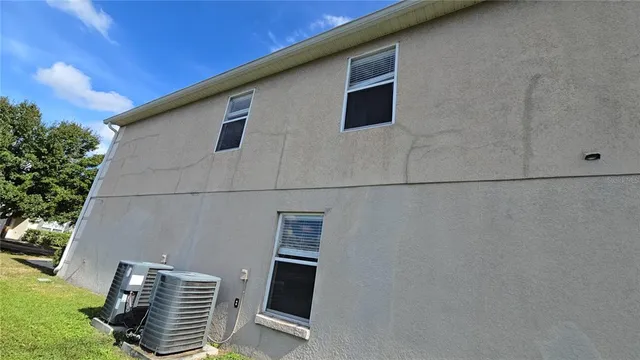 a view of a backyard with potted plants
