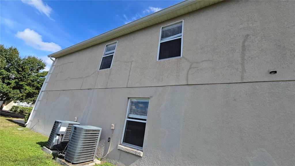 8 Windrose Drive Orlando, FL 32824 - Photo 5 of 23 a front view of a house with windows