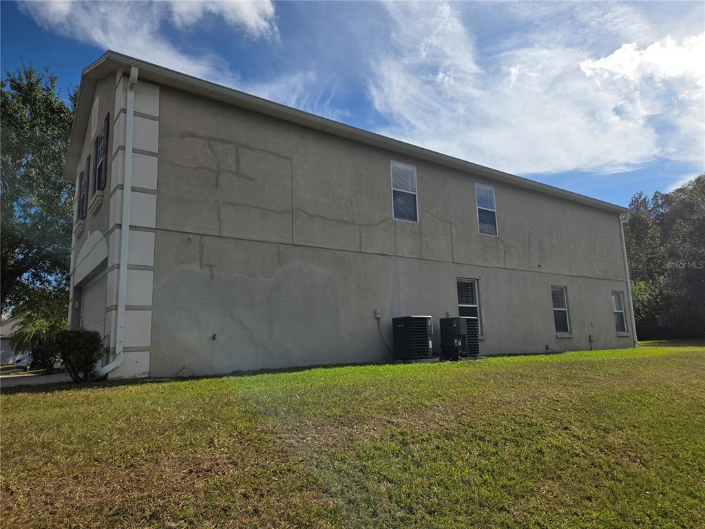 8 Windrose Drive Orlando, FL 32824 - Photo 6 of 23 a view of a backyard with potted plants