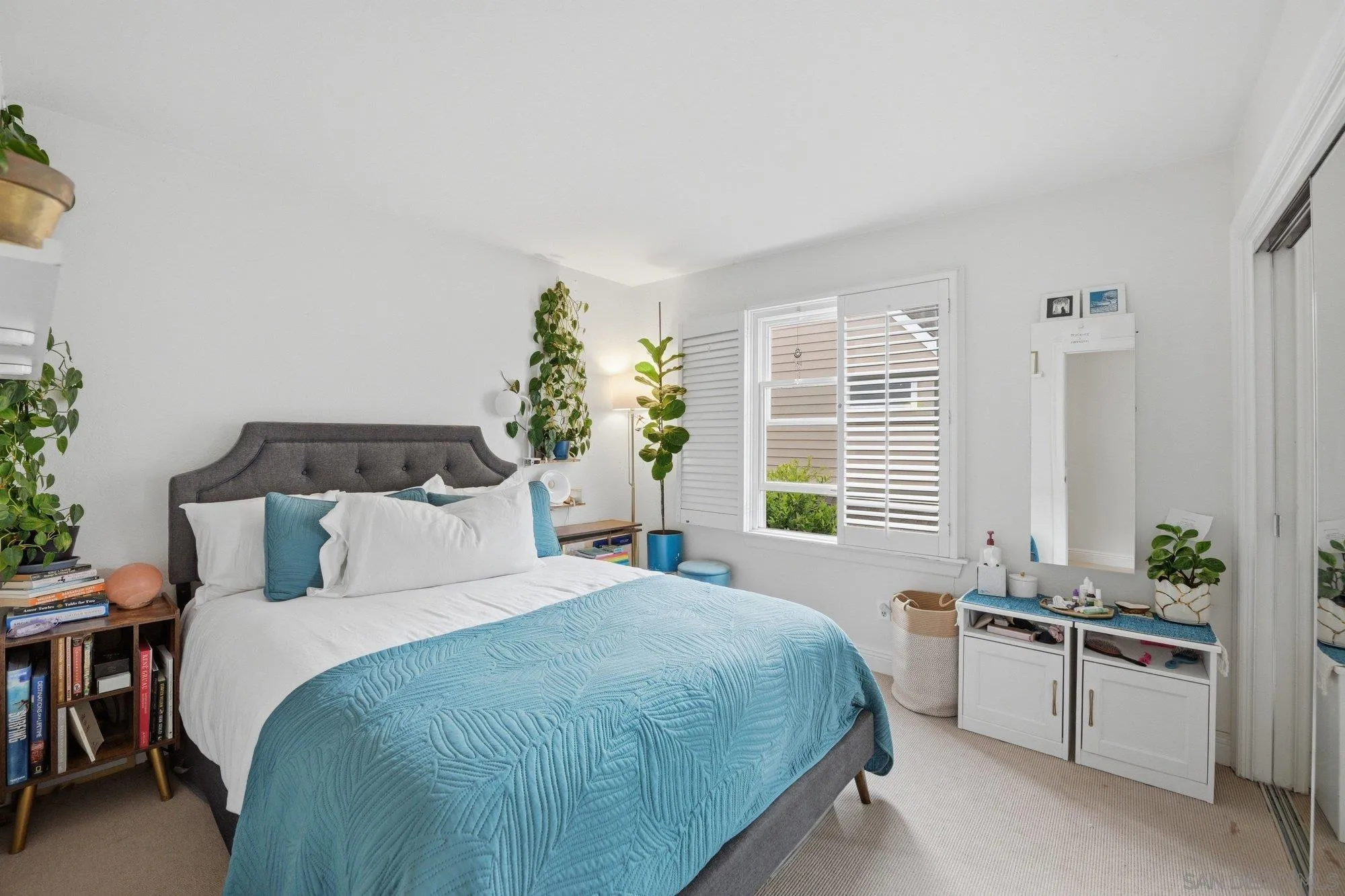 711 Kline Street, Unit A La Jolla, CA 92037 - Photo 12 of 20 a bedroom with a bed and a window