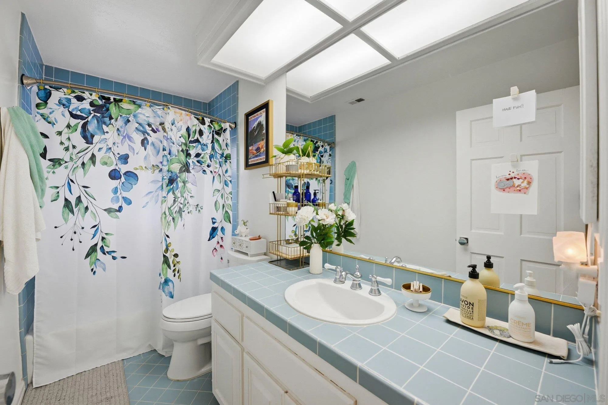 711 Kline Street, Unit A La Jolla, CA 92037 - Photo 14 of 20 a bathroom with a sink toilet and shower
