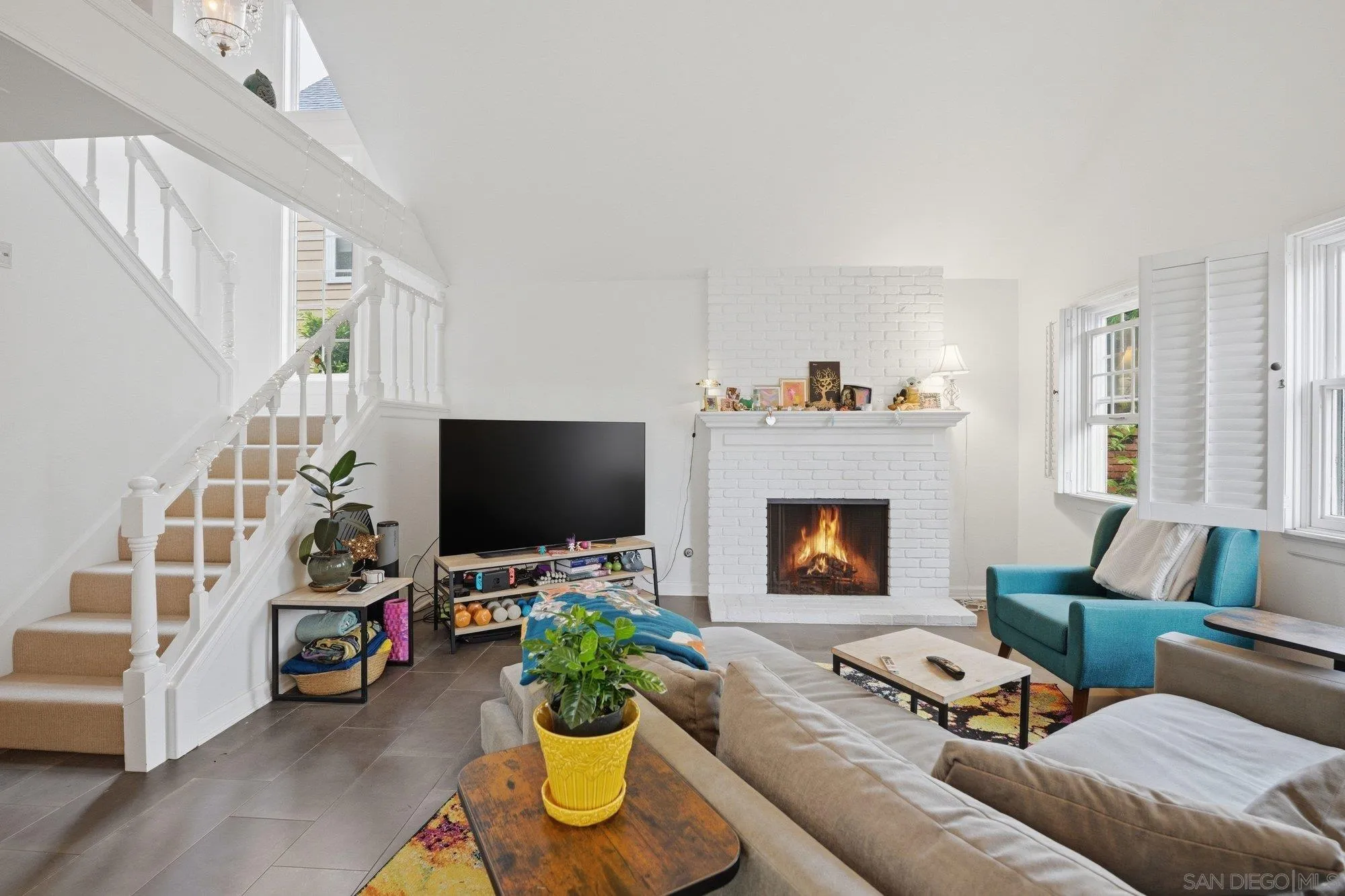 711 Kline Street, Unit A La Jolla, CA 92037 - Photo 4 of 20 a living room with furniture and a flat screen tv