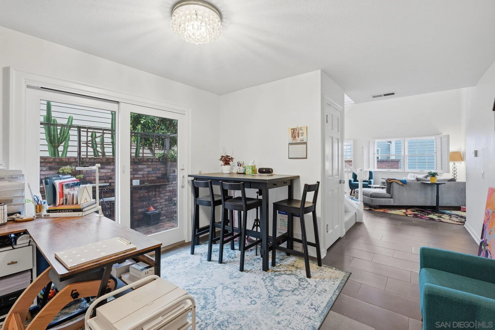 711 Kline Street, Unit A La Jolla, CA 92037 - Photo 5 of 20 a view of a dining room with furniture and a potted plant