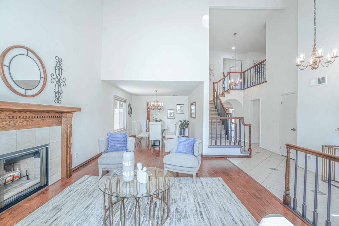 847 Pacheco Drive Milpitas, CA 95035 - Photo 12 of 68 a living room with furniture a fireplace and wooden floor