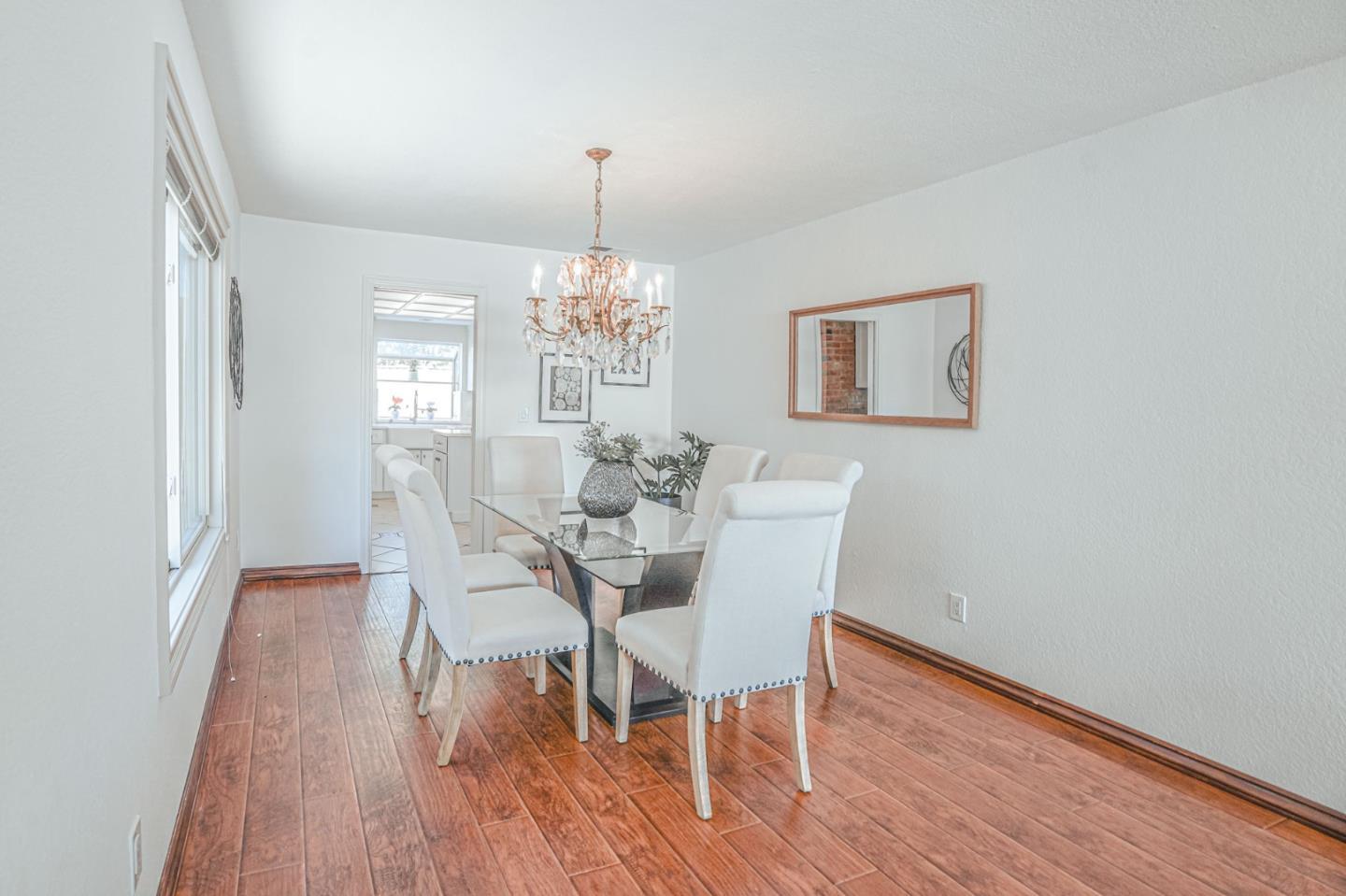 847 Pacheco Drive Milpitas, CA 95035 - Photo 13 of 68 a view of a dining room with furniture and wooden floor