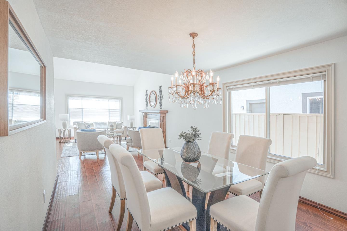 847 Pacheco Drive Milpitas, CA 95035 - Photo 14 of 68 a view of a dining room with furniture a chandelier and wooden floor
