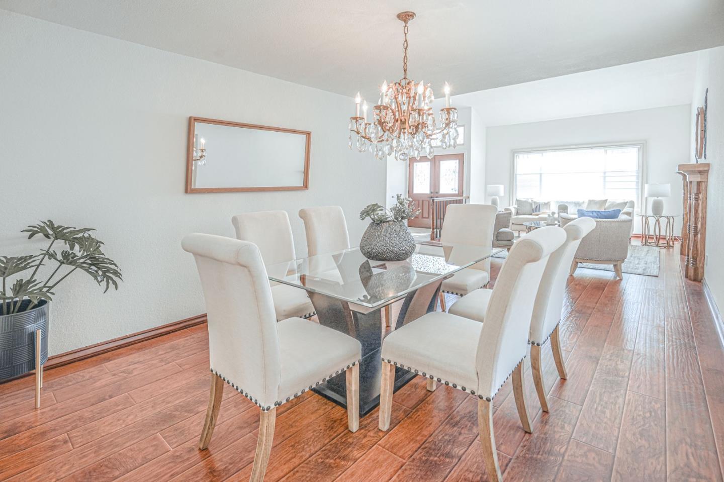 847 Pacheco Drive Milpitas, CA 95035 - Photo 15 of 68 a view of a dining room with furniture a chandelier and wooden floor