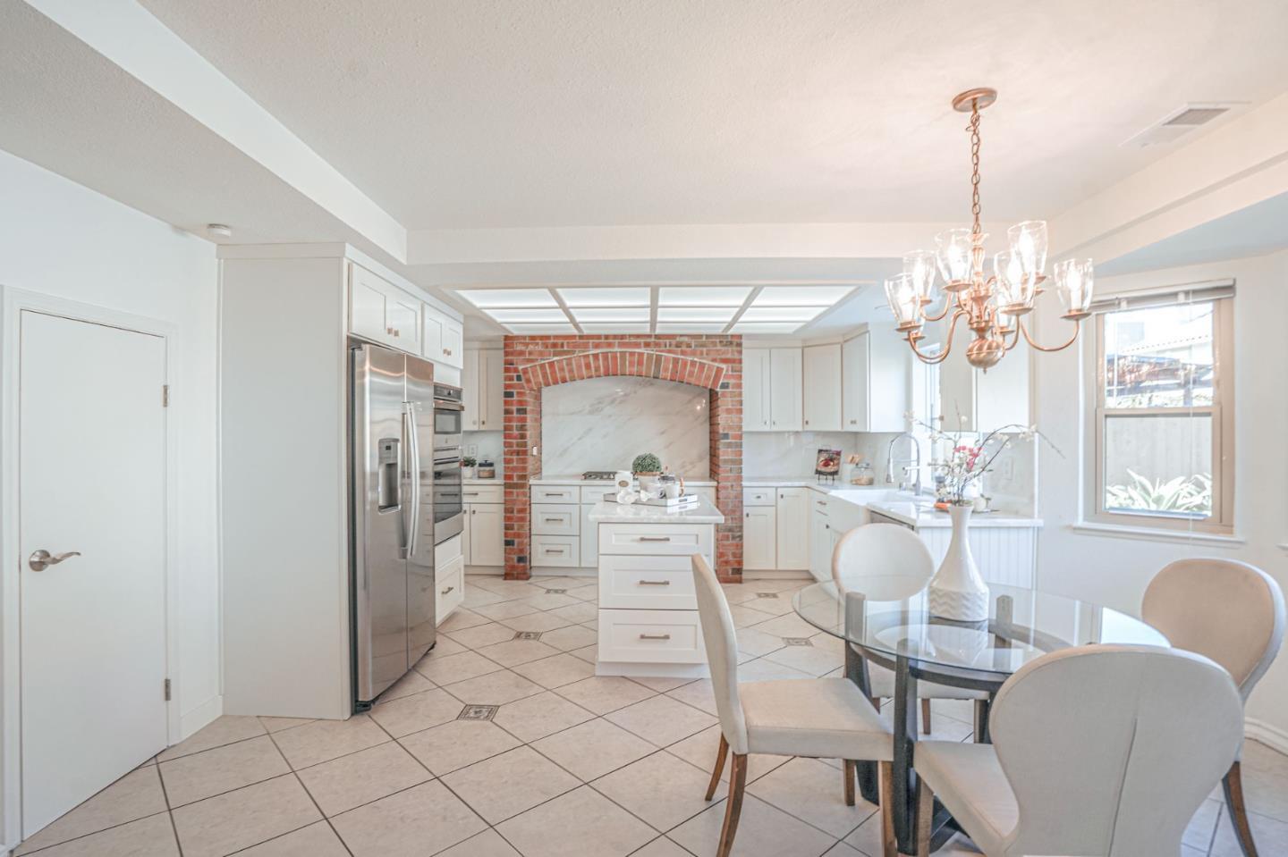 847 Pacheco Drive Milpitas, CA 95035 - Photo 21 of 68 a view of a dining room with furniture a chandelier and window