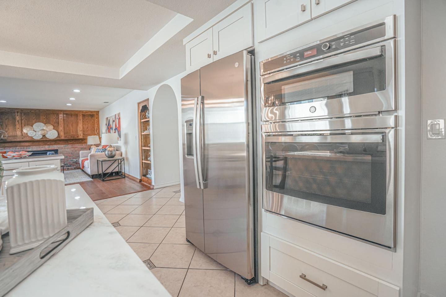 847 Pacheco Drive Milpitas, CA 95035 - Photo 22 of 68 a kitchen with stainless steel appliances kitchen island granite countertop a refrigerator and a stove top oven