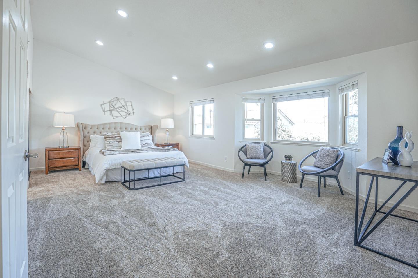 847 Pacheco Drive Milpitas, CA 95035 - Photo 43 of 68 a spacious bedroom with a bed and large windows