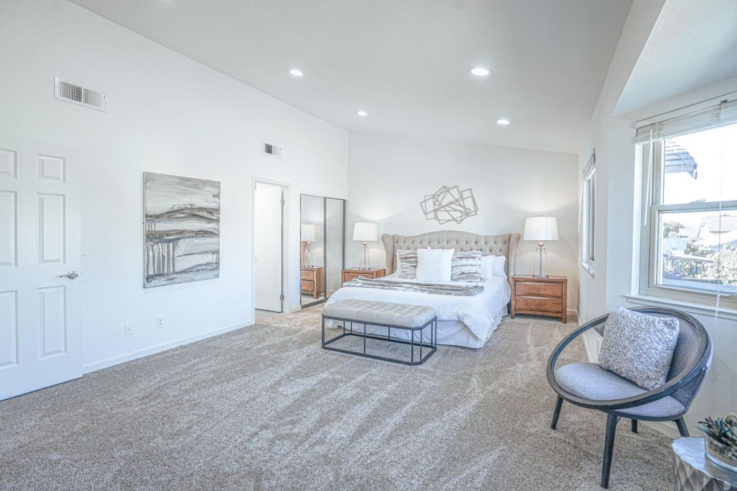 847 Pacheco Drive Milpitas, CA 95035 - Photo 47 of 68 a spacious bedroom with a bed and glass windows