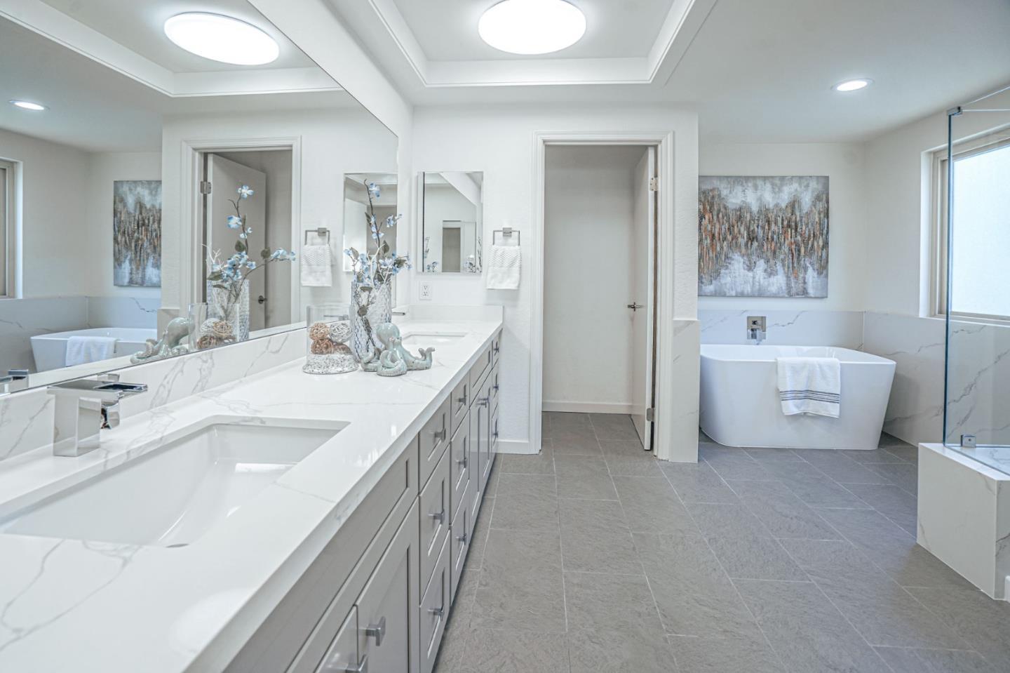 847 Pacheco Drive Milpitas, CA 95035 - Photo 50 of 68 a spacious bathroom with a double vanity sink a mirror and a bathtub