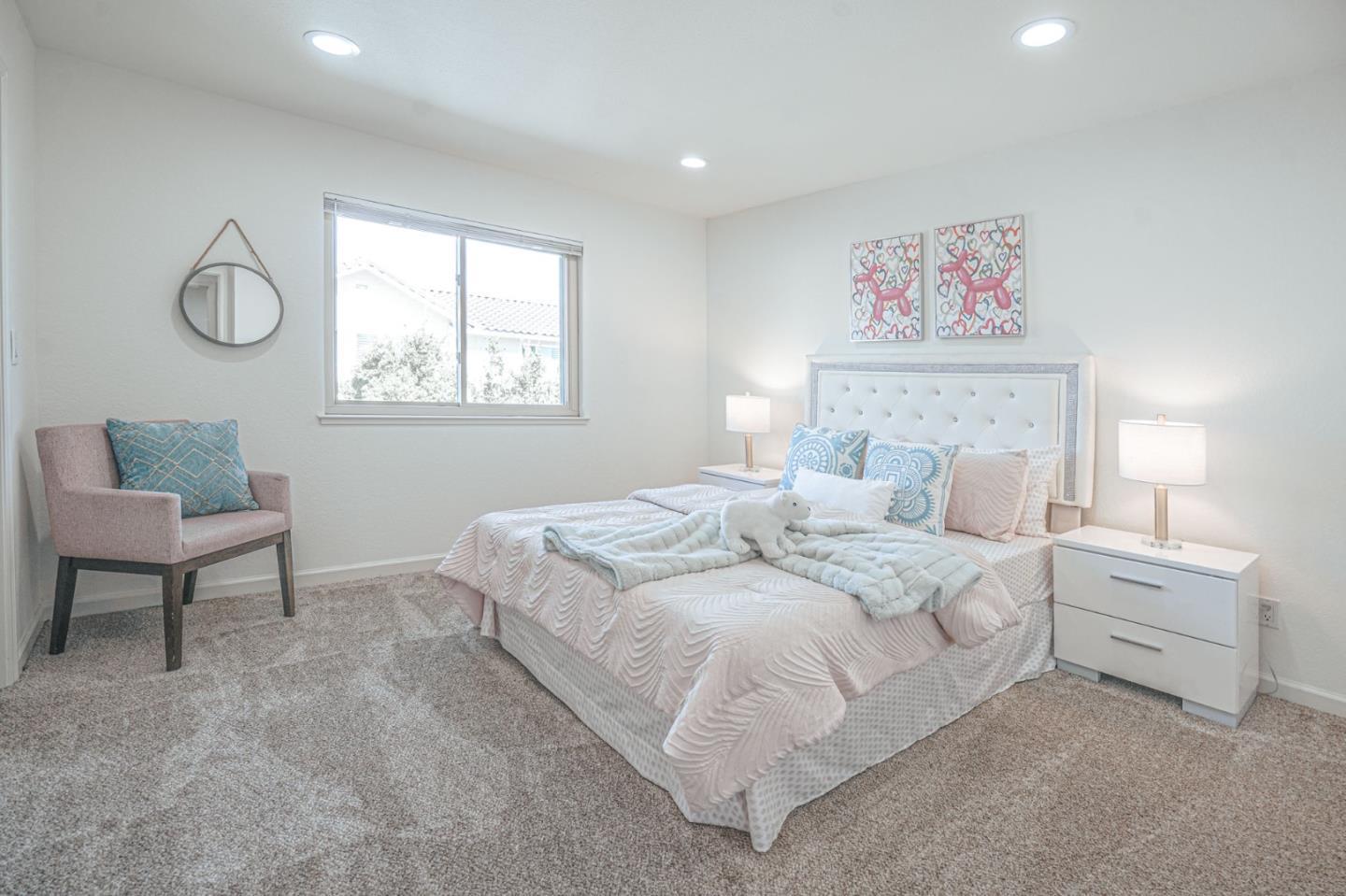 847 Pacheco Drive Milpitas, CA 95035 - Photo 54 of 68 a bedroom with a bed a mirror and a window