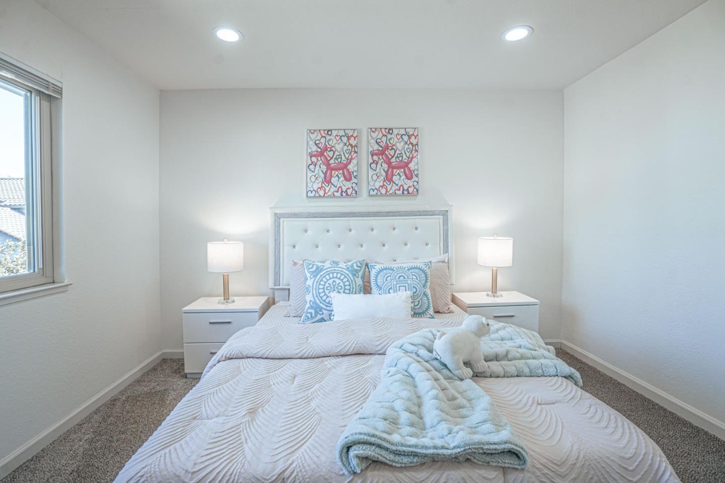 847 Pacheco Drive Milpitas, CA 95035 - Photo 56 of 68 a bedroom with a bed and a painting on the wall