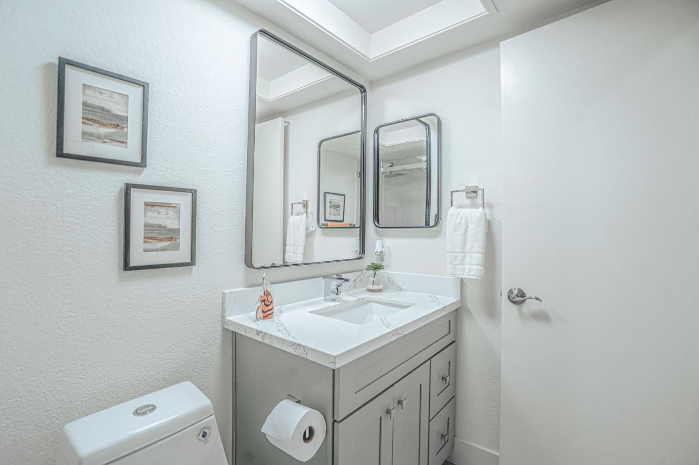 847 Pacheco Drive Milpitas, CA 95035 - Photo 58 of 68 a bathroom with a sink mirror vanity and toilet