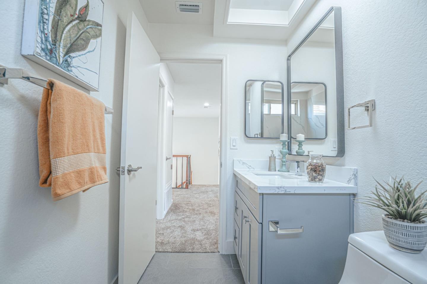 847 Pacheco Drive Milpitas, CA 95035 - Photo 60 of 68 a bathroom with a sink a vanity and a mirror