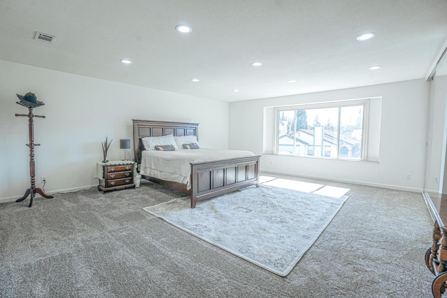 847 Pacheco Drive Milpitas, CA 95035 - Photo 61 of 68 a spacious bedroom with a bed and a window