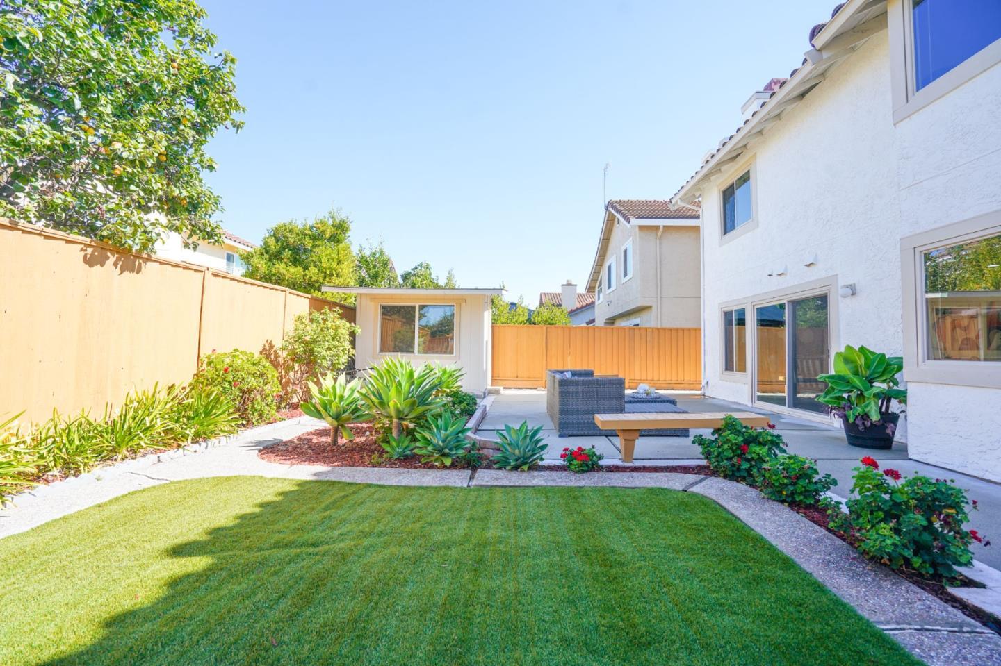 847 Pacheco Drive Milpitas, CA 95035 - Photo 66 of 68 a front view of a house with a yard
