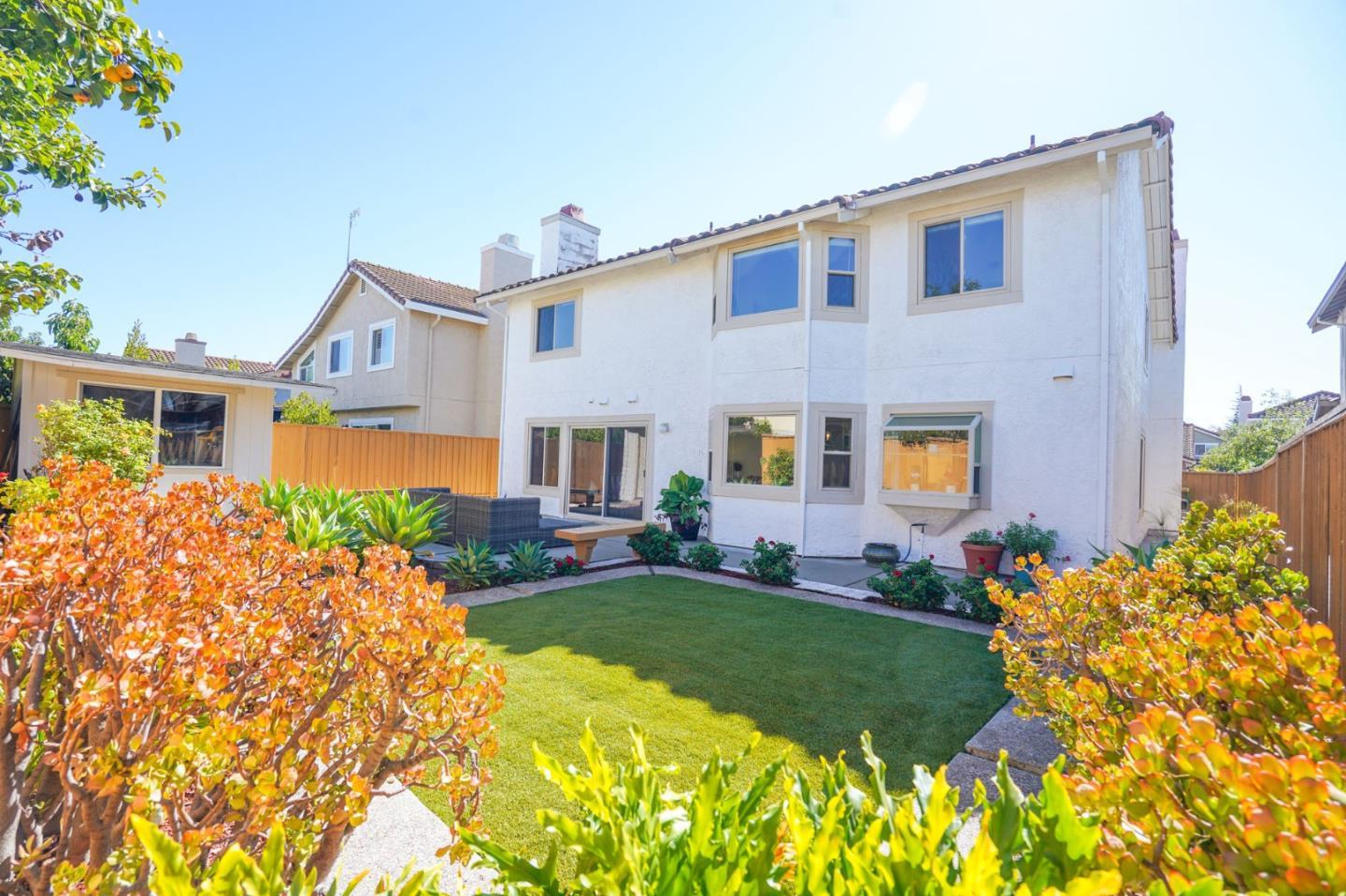 847 Pacheco Drive Milpitas, CA 95035 - Photo 67 of 68 a front view of a house with a garden and plants