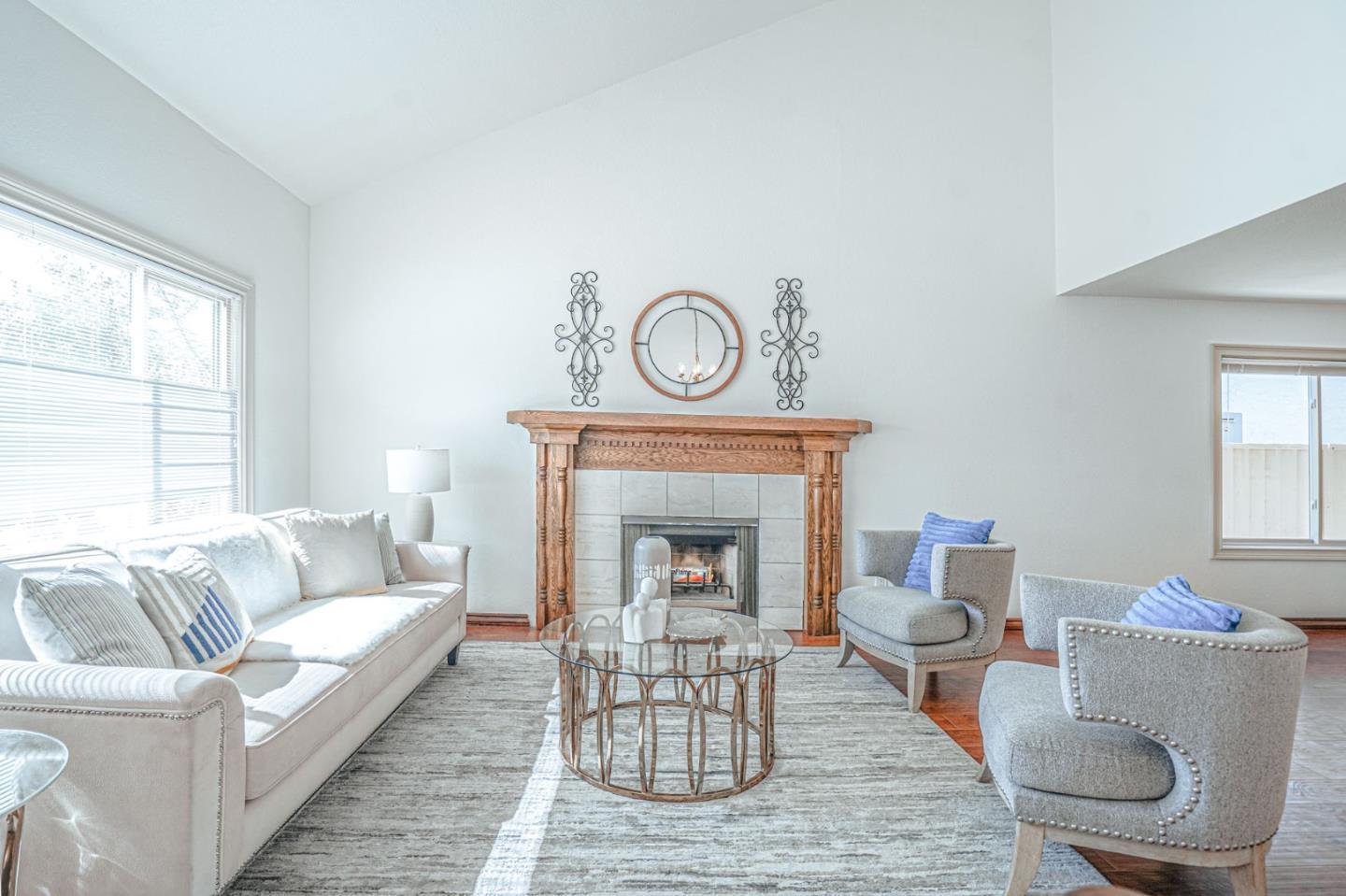 847 Pacheco Drive Milpitas, CA 95035 - Photo 10 of 68 a living room with furniture and a fireplace