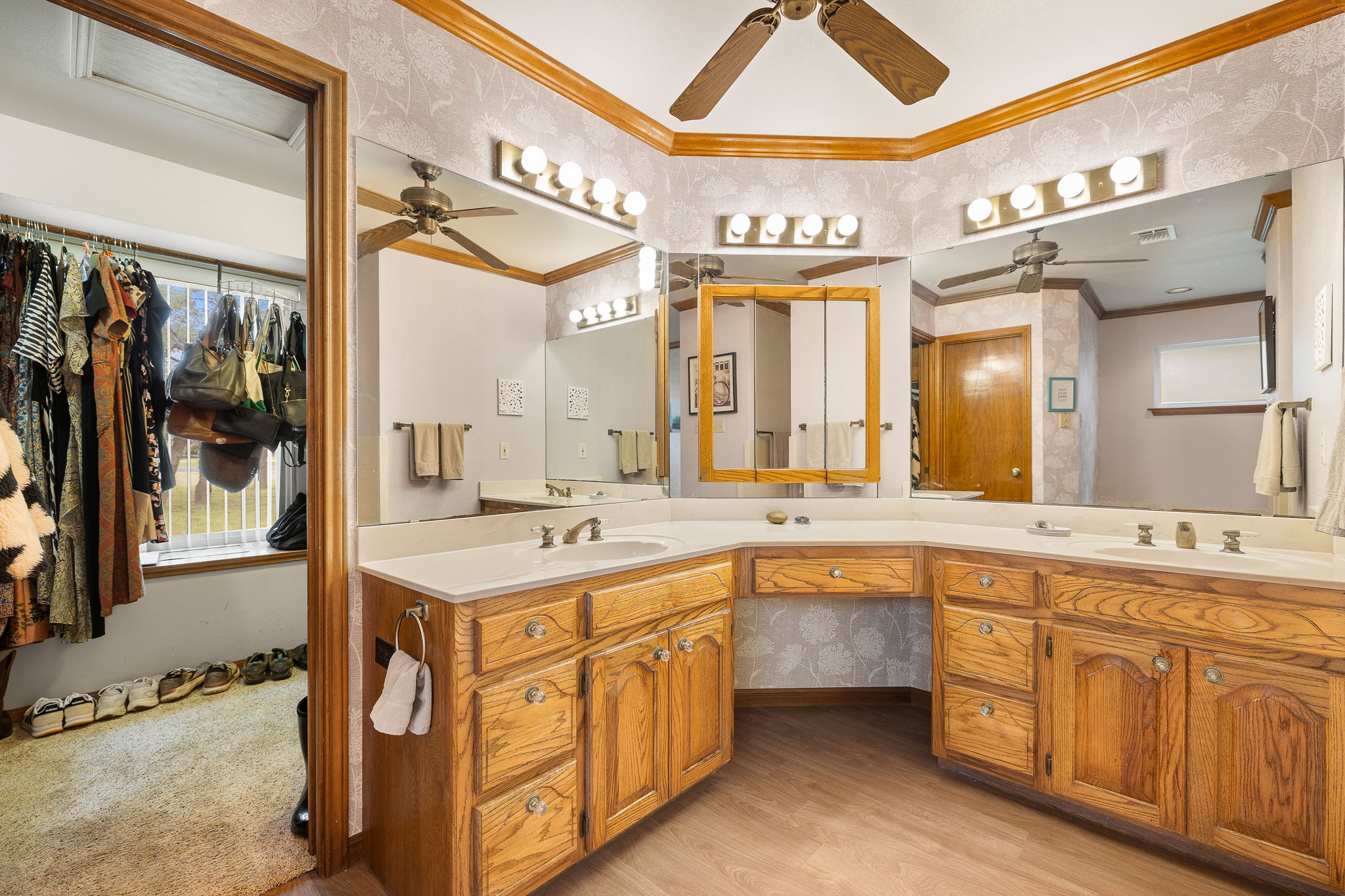 136 Valley View Road Georgetown, TX 78633 - Photo 23 of 40 This primary bathroom even has a space for a chair to sit and do your nighttime routine. Huge walk-in closet is perfectly situated off of this bathroom and even has a window!