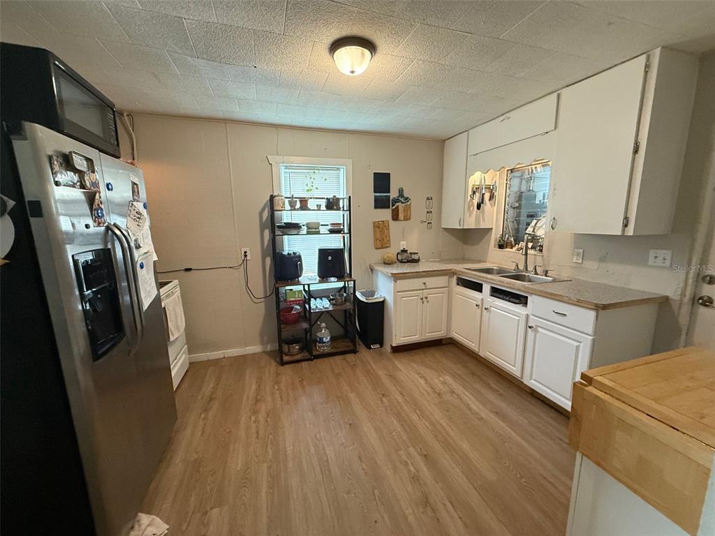 1222 Golconda Road Lakeland, FL 33801 - Photo 12 of 12 a kitchen with stainless steel appliances a sink a stove a refrigerator and cabinets