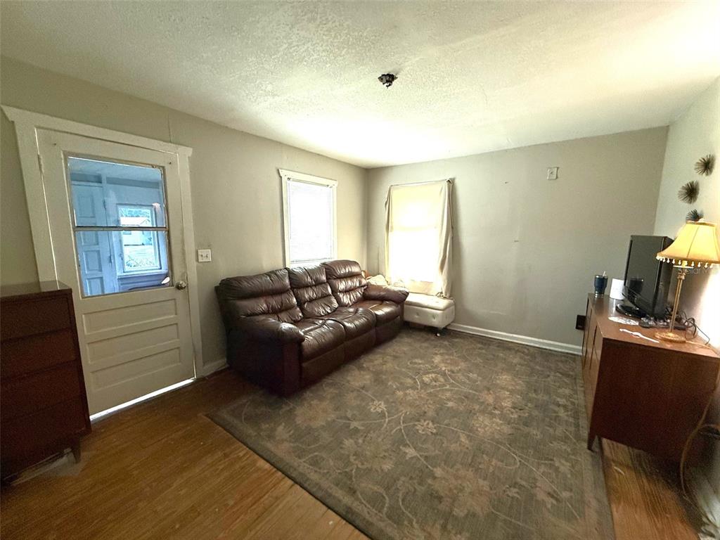 1222 Golconda Road Lakeland, FL 33801 - Photo 6 of 12 a living room with furniture and a window