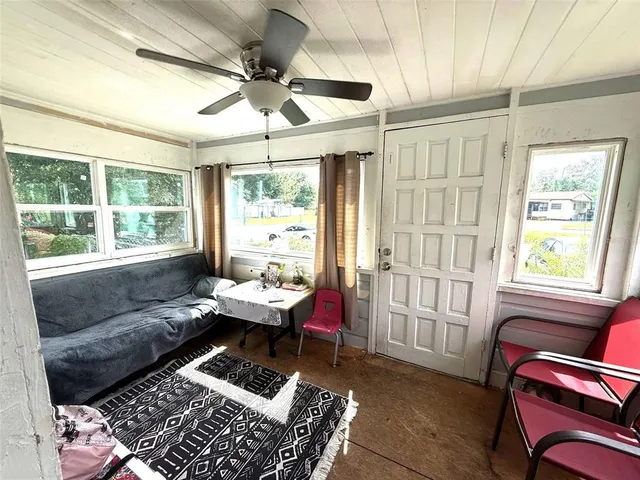 a living room with furniture and a window