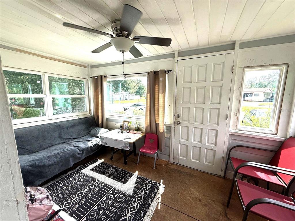 1222 Golconda Road Lakeland, FL 33801 - Photo 7 of 12 a living room with furniture and a window