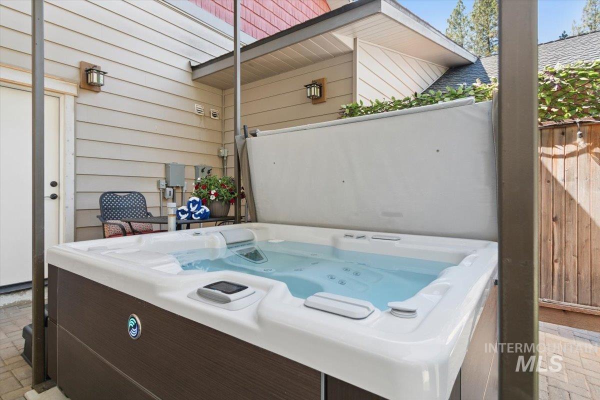 36 Kevins Way Garden Valley, ID 83622 - Photo 13 of 50 View of patio with a hot tub and a wooded view