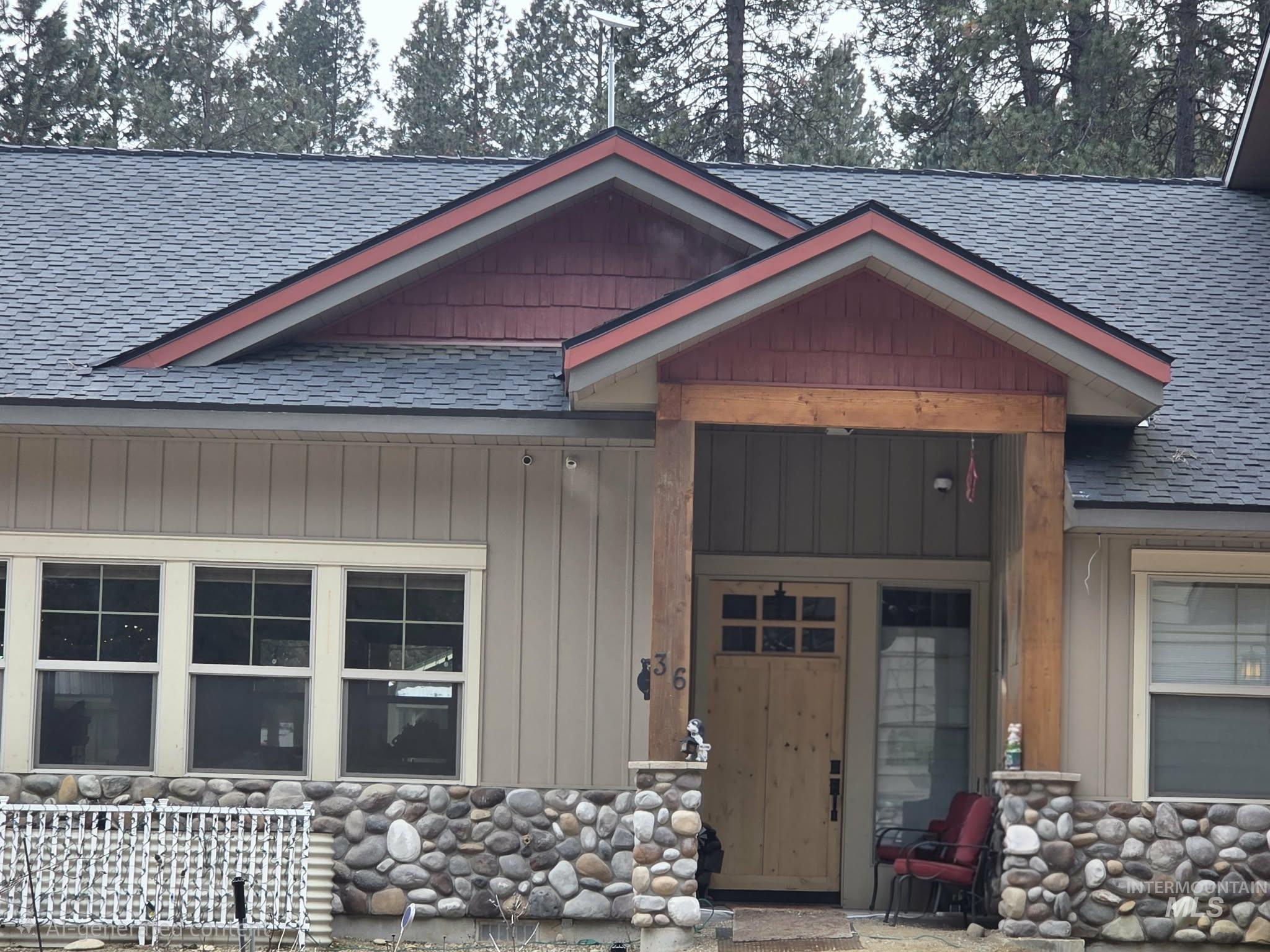 36 Kevins Way Garden Valley, ID 83622 - Photo 2 of 50 View of front of home with roof with shingles and stone siding