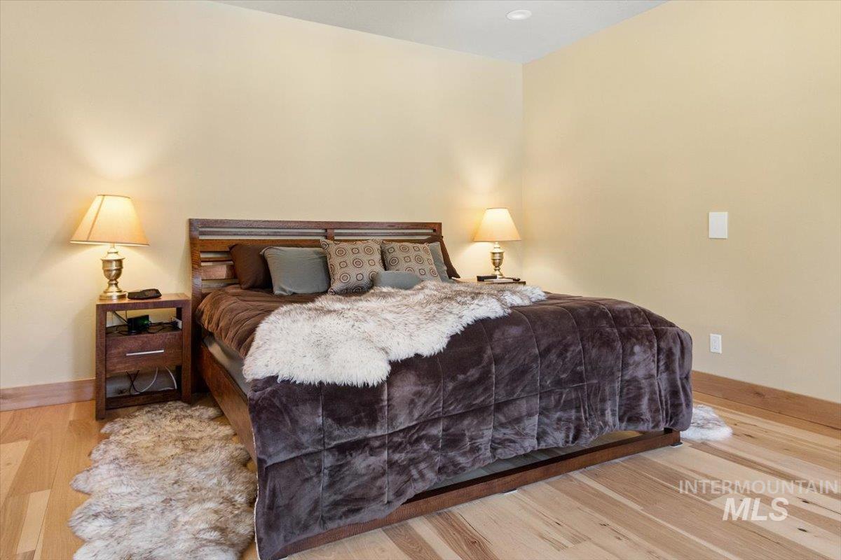 36 Kevins Way Garden Valley, ID 83622 - Photo 21 of 50 Bedroom featuring light wood-style flooring, recessed lighting, and a ceiling fan