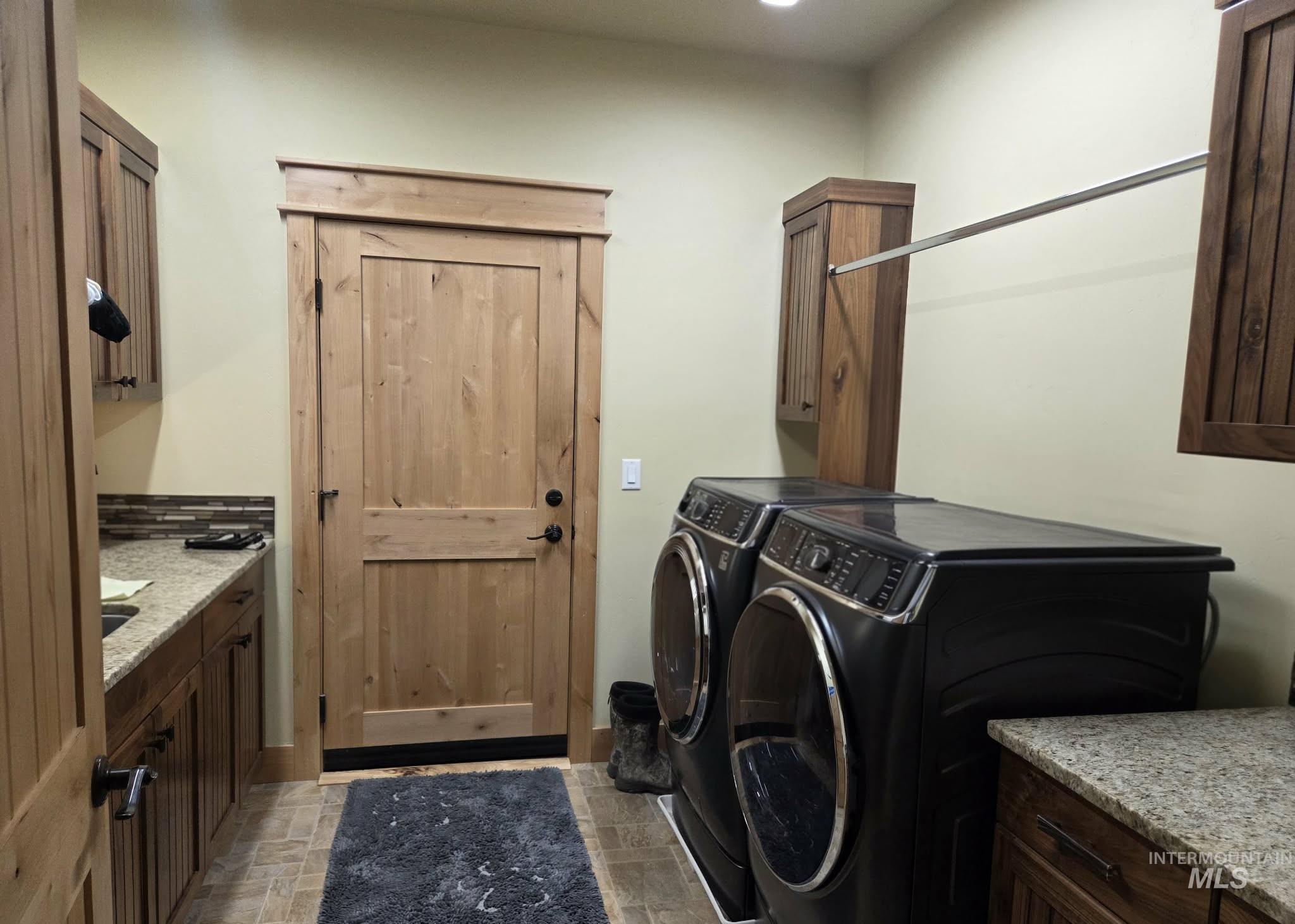 36 Kevins Way Garden Valley, ID 83622 - Photo 22 of 50 Laundry area featuring cabinet space and washing machine and dryer