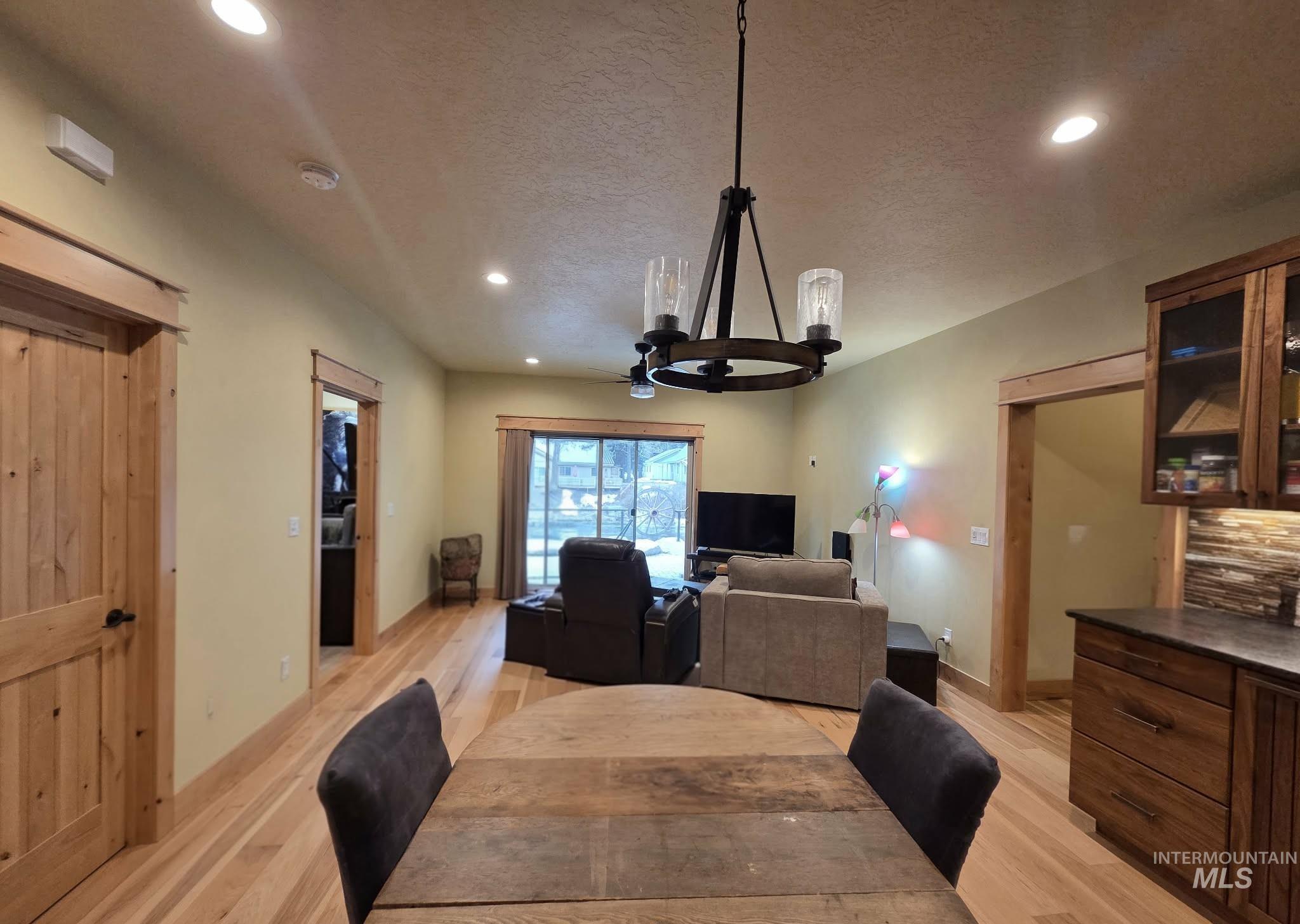 36 Kevins Way Garden Valley, ID 83622 - Photo 26 of 50 Apartment Dining area with recessed lighting, light wood-style floors, a textured ceiling, and a chandelier
