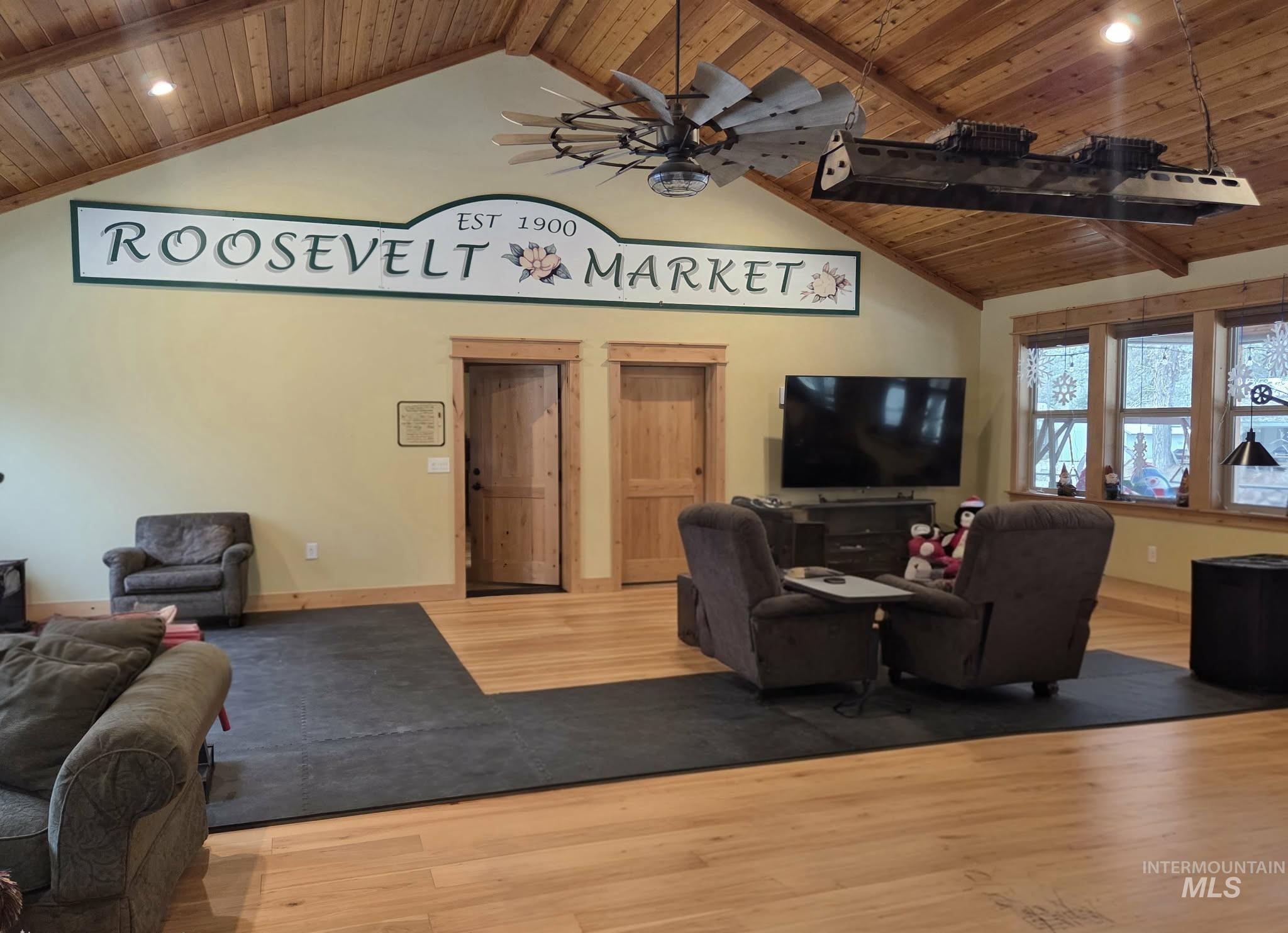 36 Kevins Way Garden Valley, ID 83622 - Photo 27 of 50 Living area featuring a wooden ceiling with exposed beams, wood finished floors, recessed lighting, ceiling fan, and high vaulted ceiling