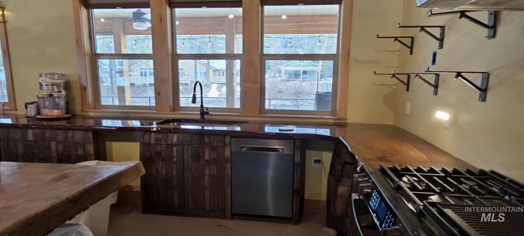 36 Kevins Way Garden Valley, ID 83622 - Photo 28 of 50 Kitchen featuring stainless steel dishwasher and gas stove