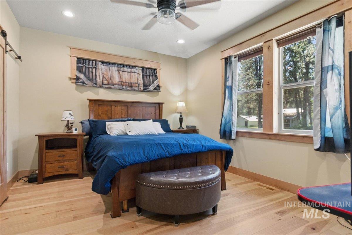 36 Kevins Way Garden Valley, ID 83622 - Photo 29 of 50 Bedroom with light wood-type flooring, recessed lighting, ceiling fan, and a textured ceiling
