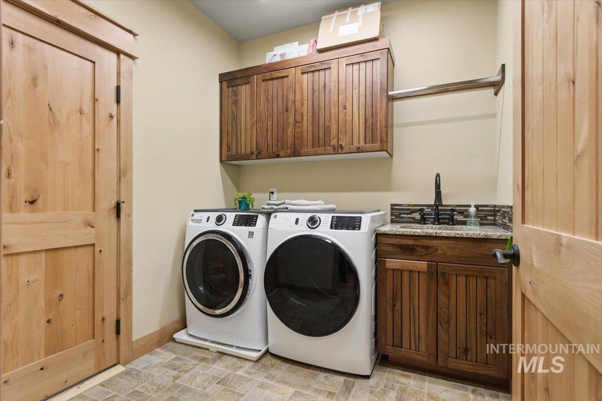 36 Kevins Way Garden Valley, ID 83622 - Photo 30 of 50 Apartment Laundry area featuring cabinet space and washer and dryer