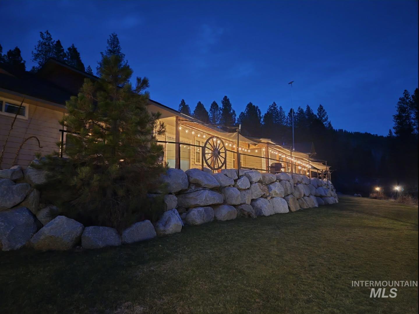 36 Kevins Way Garden Valley, ID 83622 - Photo 38 of 50 Yard at twilight featuring a lawn