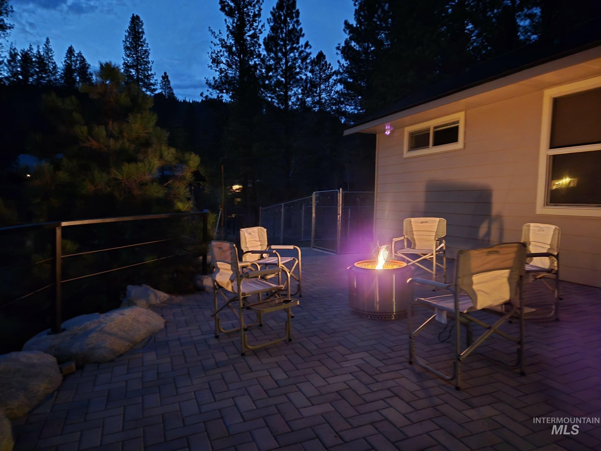 36 Kevins Way Garden Valley, ID 83622 - Photo 39 of 50 Patio at twilight with a fire pit and a patio area