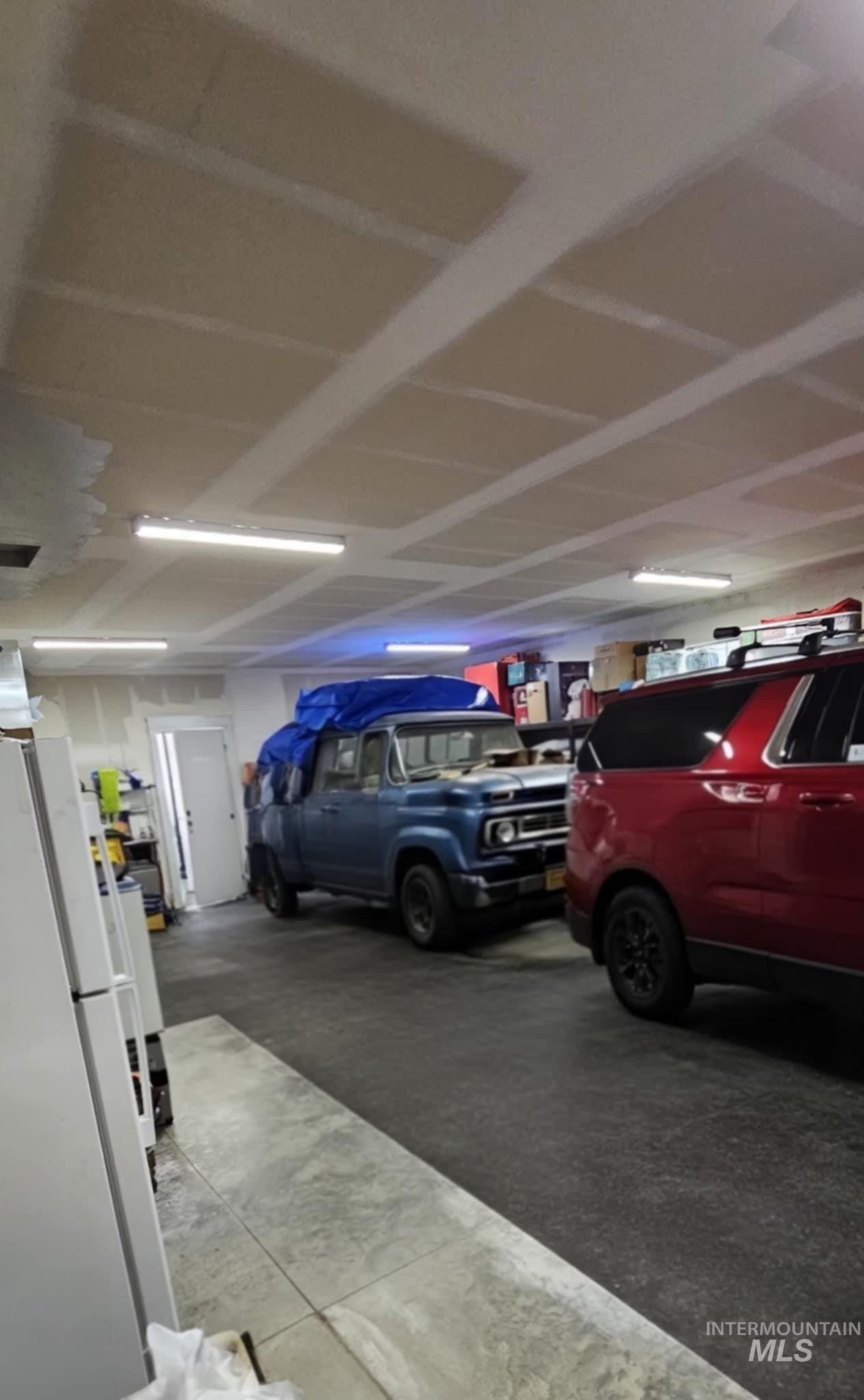 36 Kevins Way Garden Valley, ID 83622 - Photo 42 of 50 Garage with freestanding refrigerator