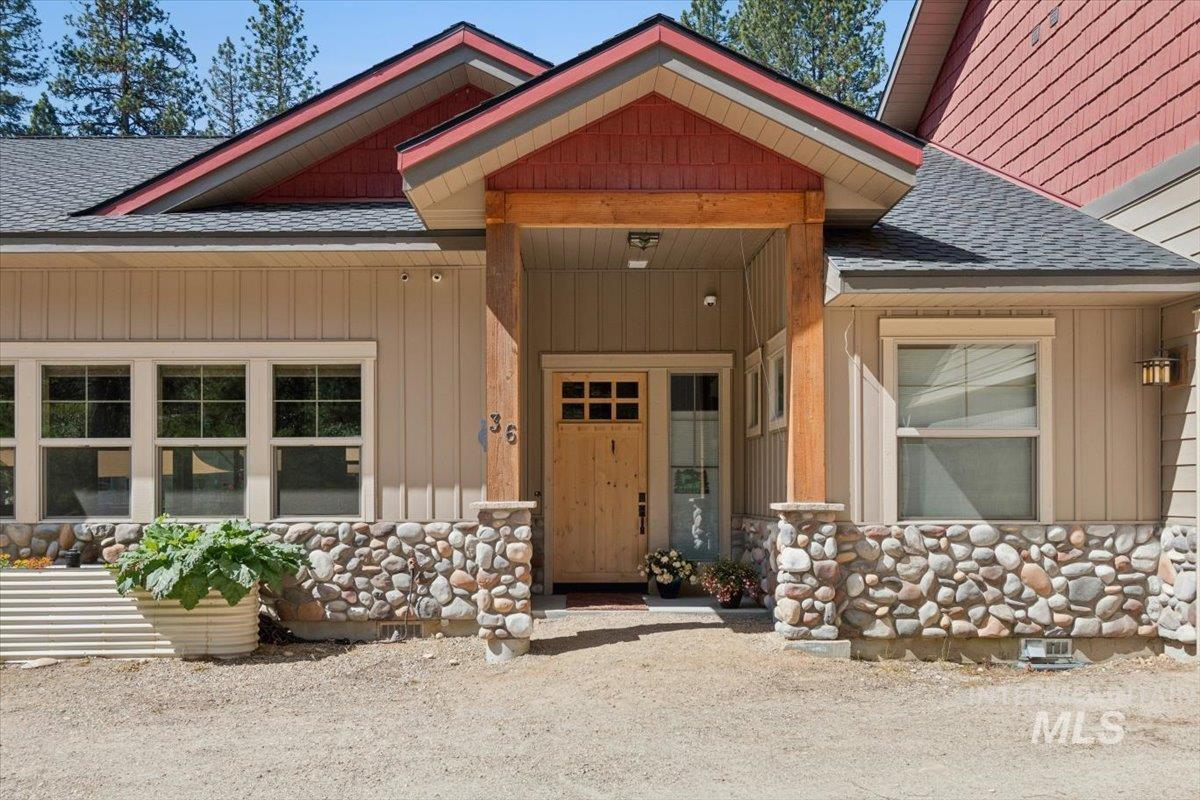 36 Kevins Way Garden Valley, ID 83622 - Photo 6 of 50 View of front of home with roof with shingles and stone siding