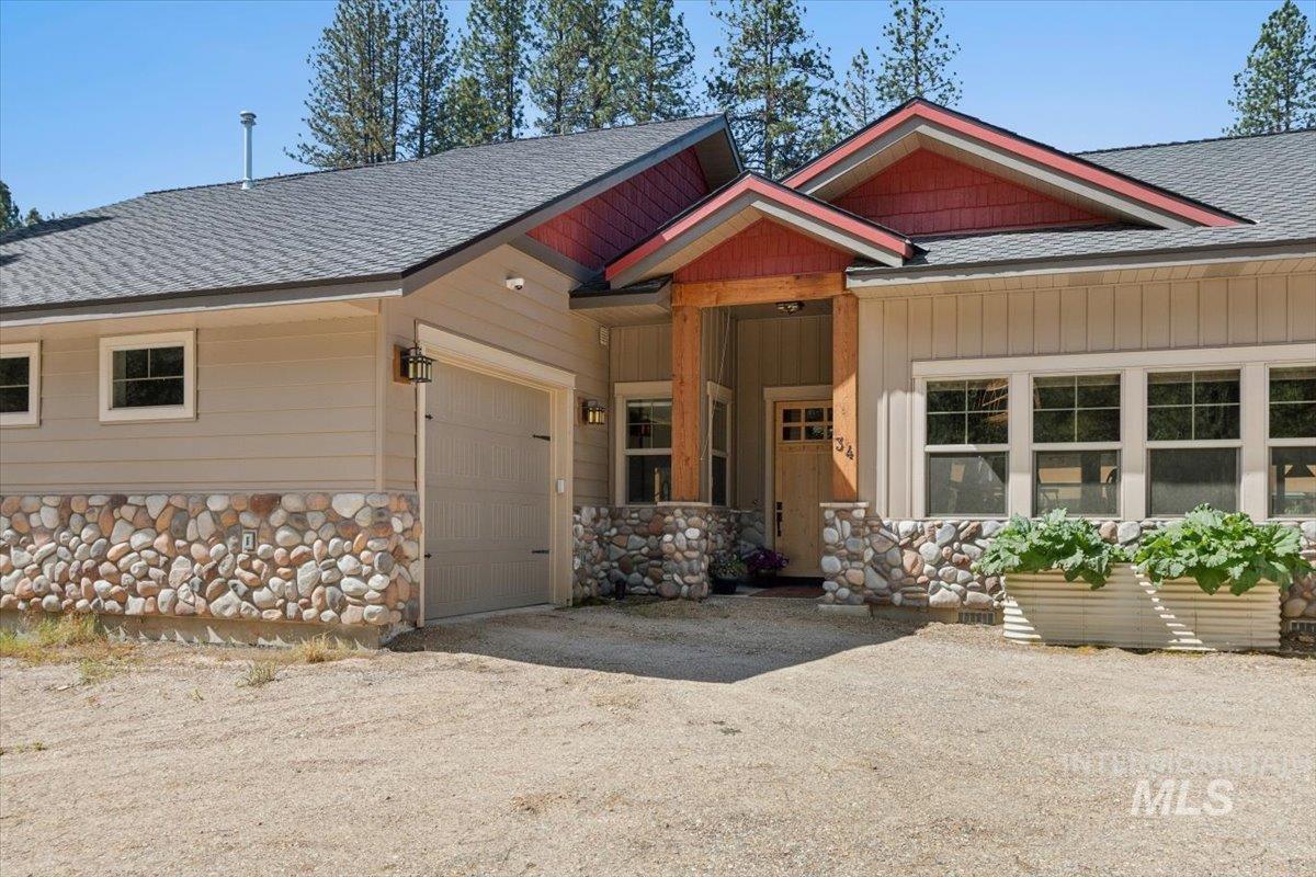 36 Kevins Way Garden Valley, ID 83622 - Photo 7 of 50 View of front facade with stone siding and roof with shingles