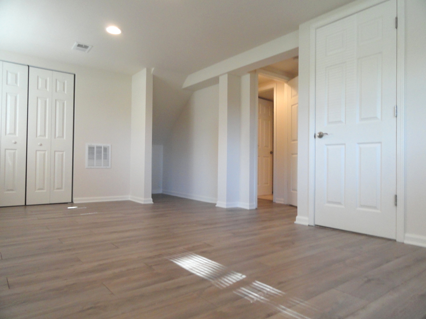 596 Maple Avenue Lisle, IL 60532 - Photo 14 of 21 a view of an empty room with wooden floor