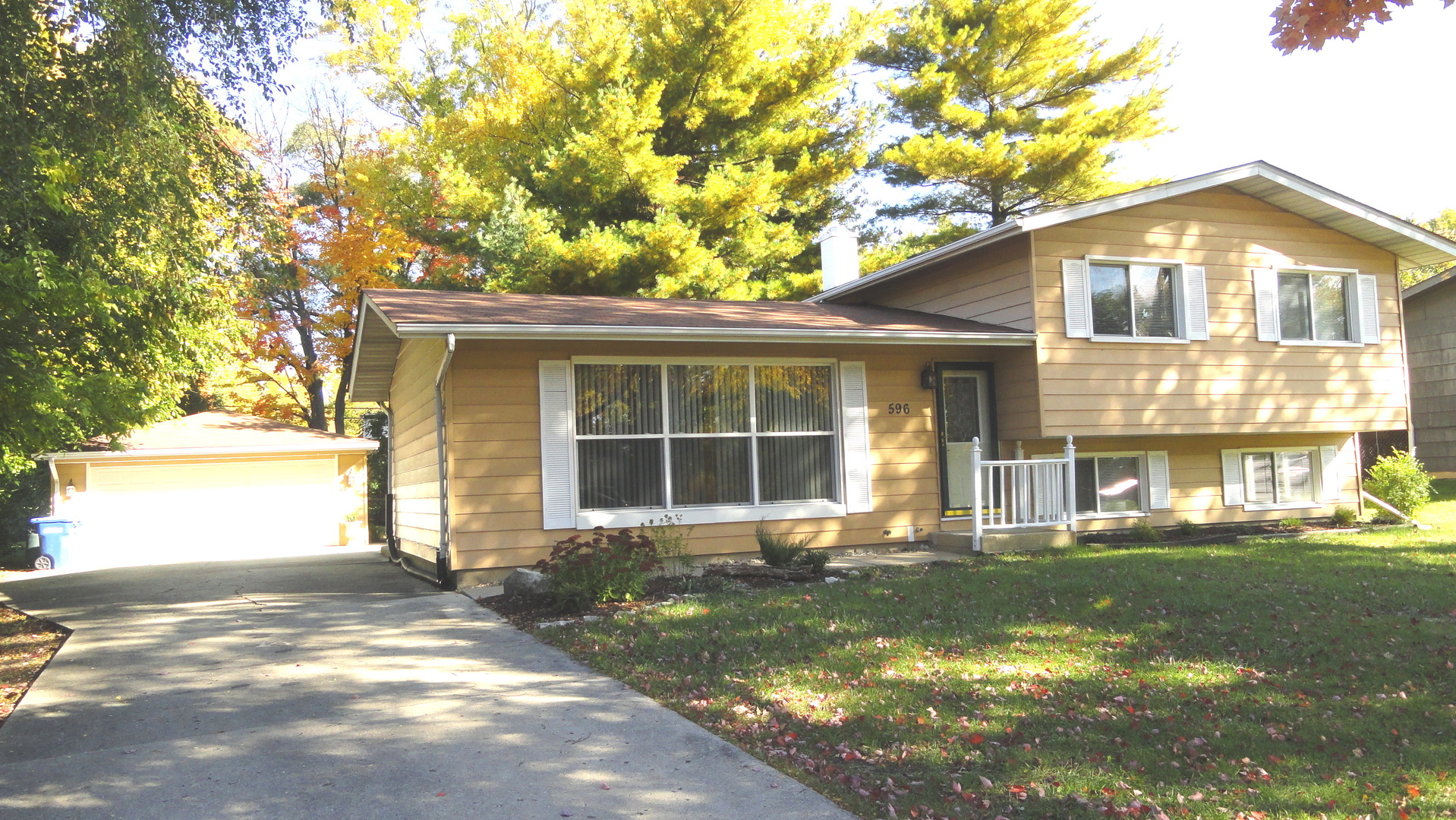 596 Maple Avenue Lisle, IL 60532 - Photo 2 of 21 a front view of a house with a yard