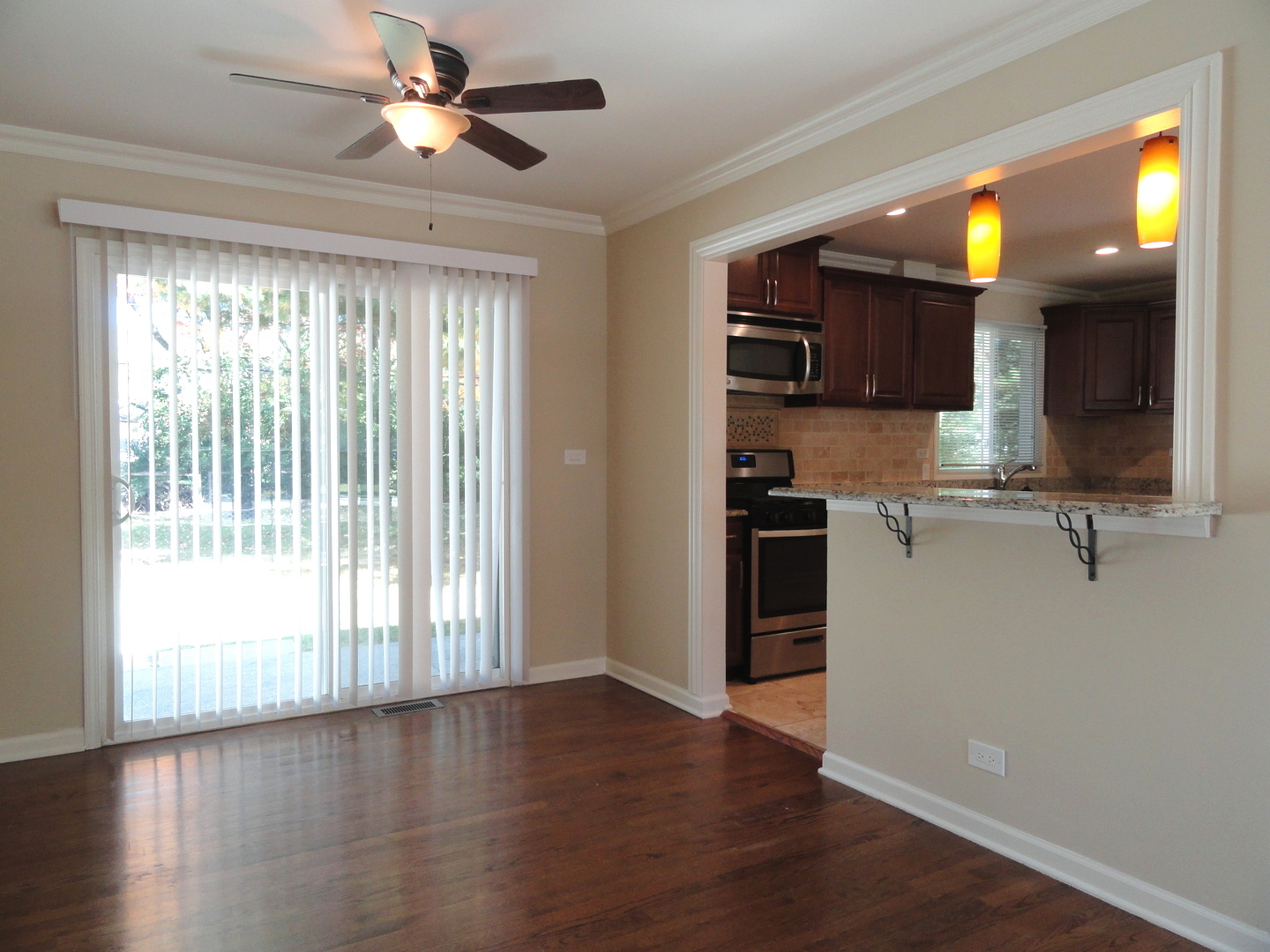 596 Maple Avenue Lisle, IL 60532 - Photo 7 of 21 a view of a kitchen with a sink and a window