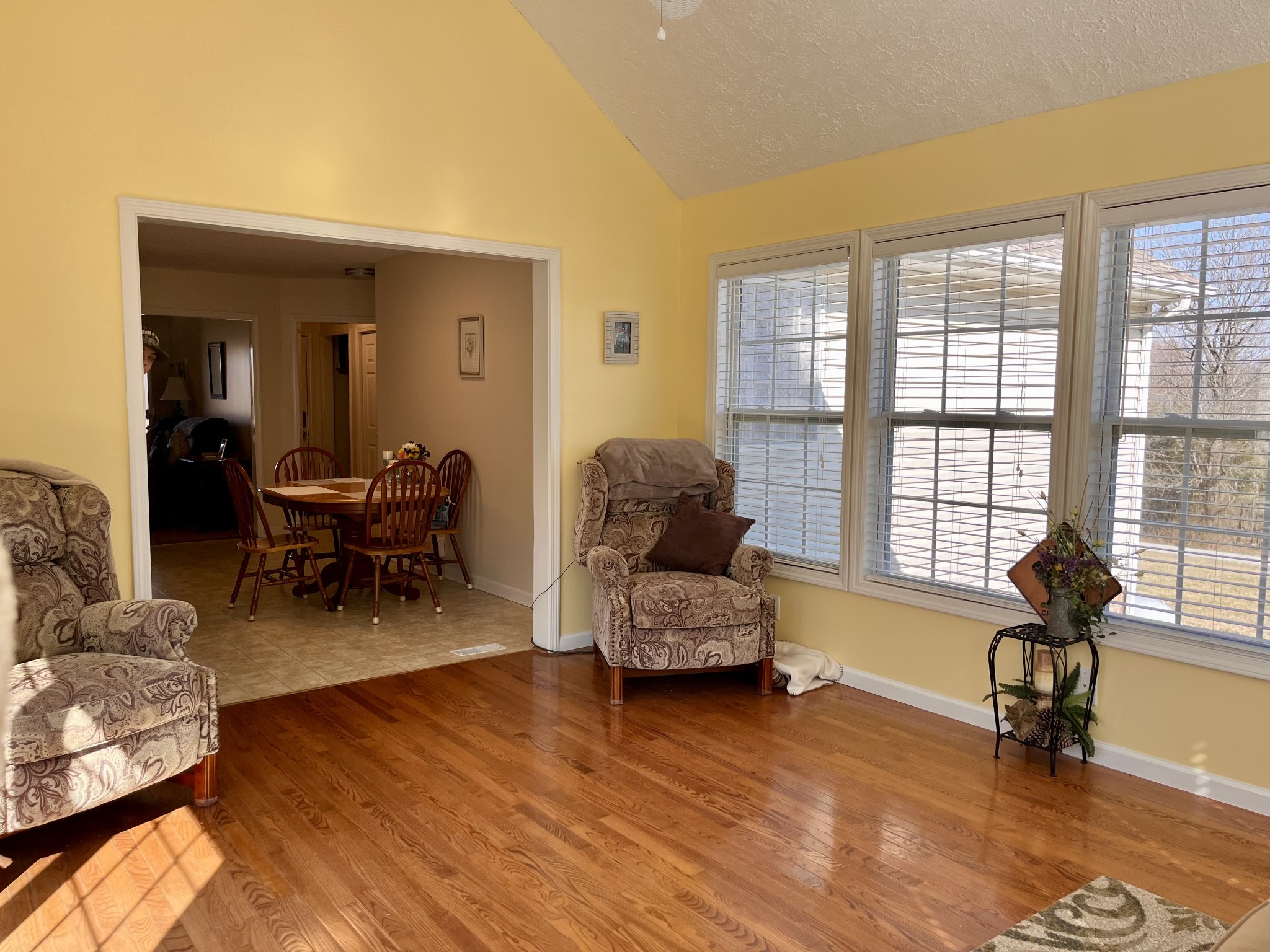4869 Starks Road Cross Plains, TN 37049 - Photo 16 of 46 a living room with furniture and a large window with wooden floor