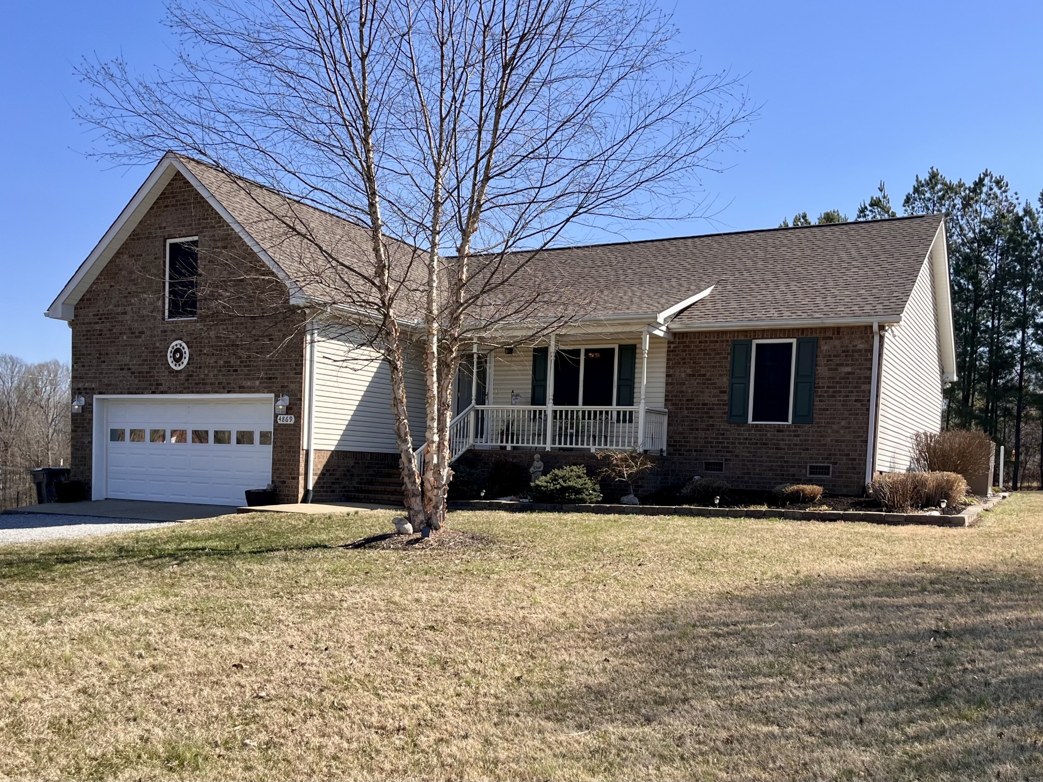 4869 Starks Road Cross Plains, TN 37049 - Photo 2 of 46 a front view of a house with a yard
