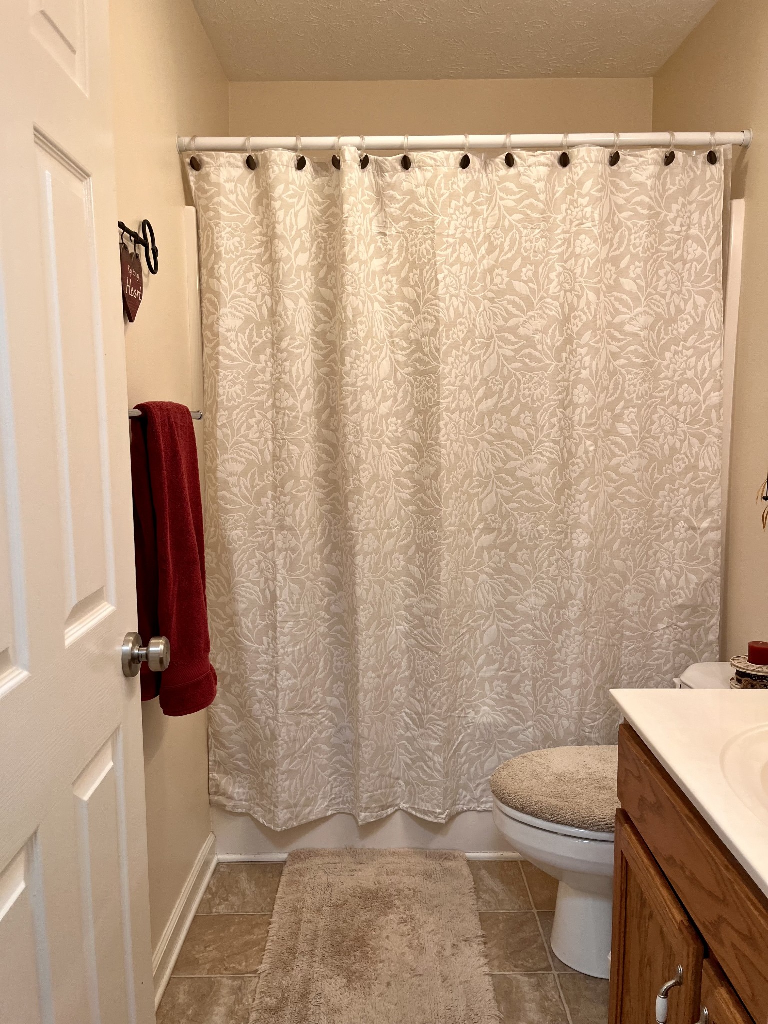 4869 Starks Road Cross Plains, TN 37049 - Photo 22 of 46 a bathroom with a shower curtain and a sink